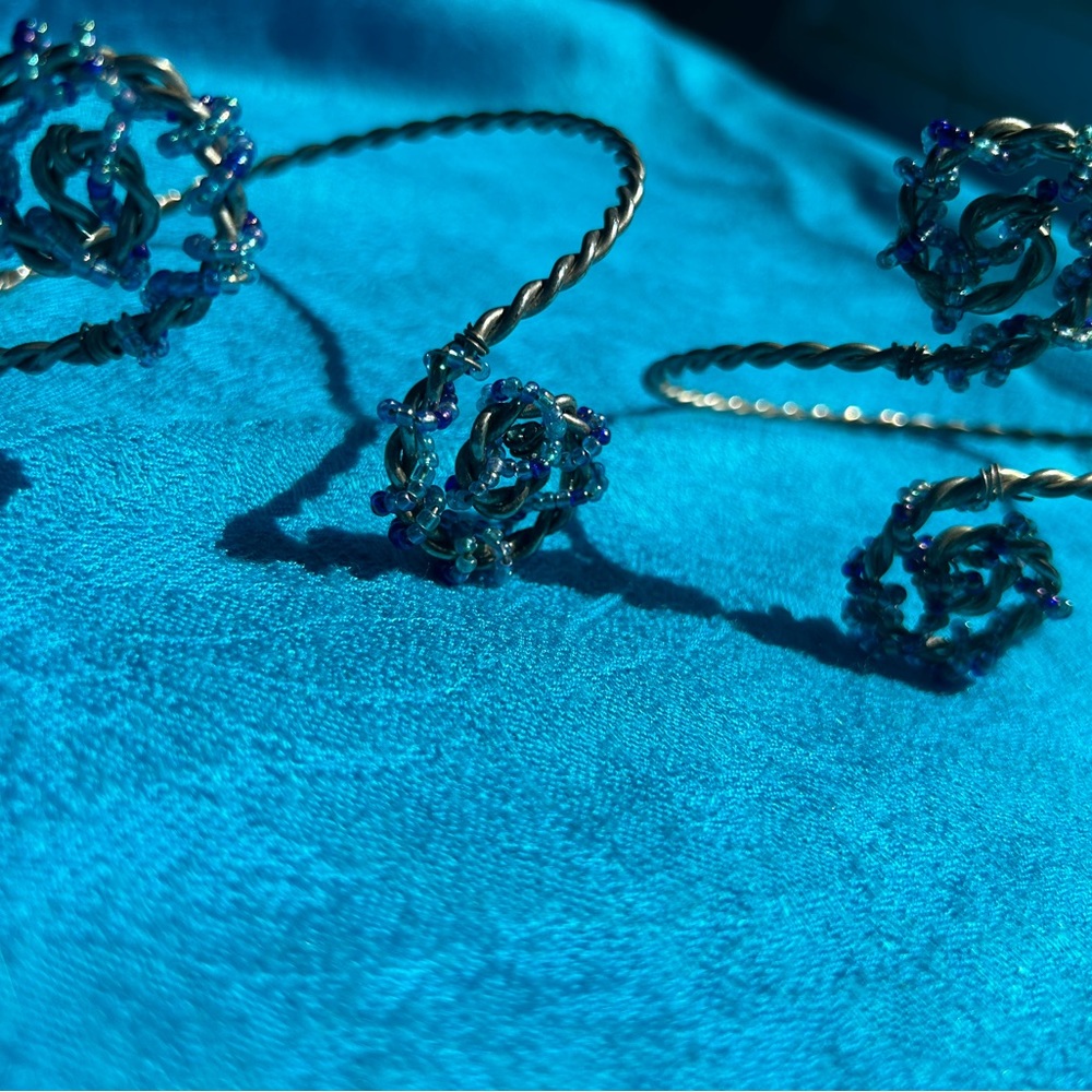 TWO UPPER ARM BEADED BRACELETS